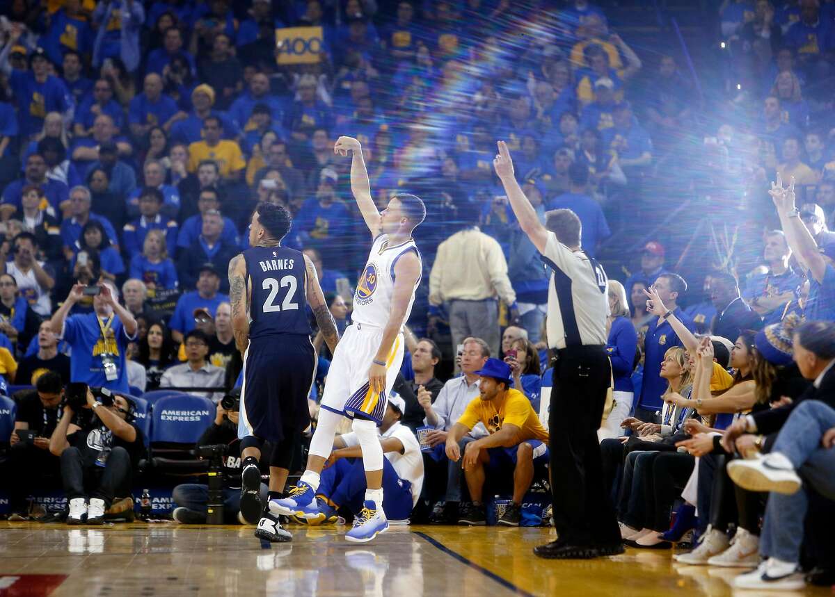 Golden State Warriors' Stephen Curry hits his 400th 3-pointer of the season in 3rd quarter against Memphis Grizzlies during NBA game at Oracle Arena in Oakland, Calif., on Wednesday, April 13, 2016.
