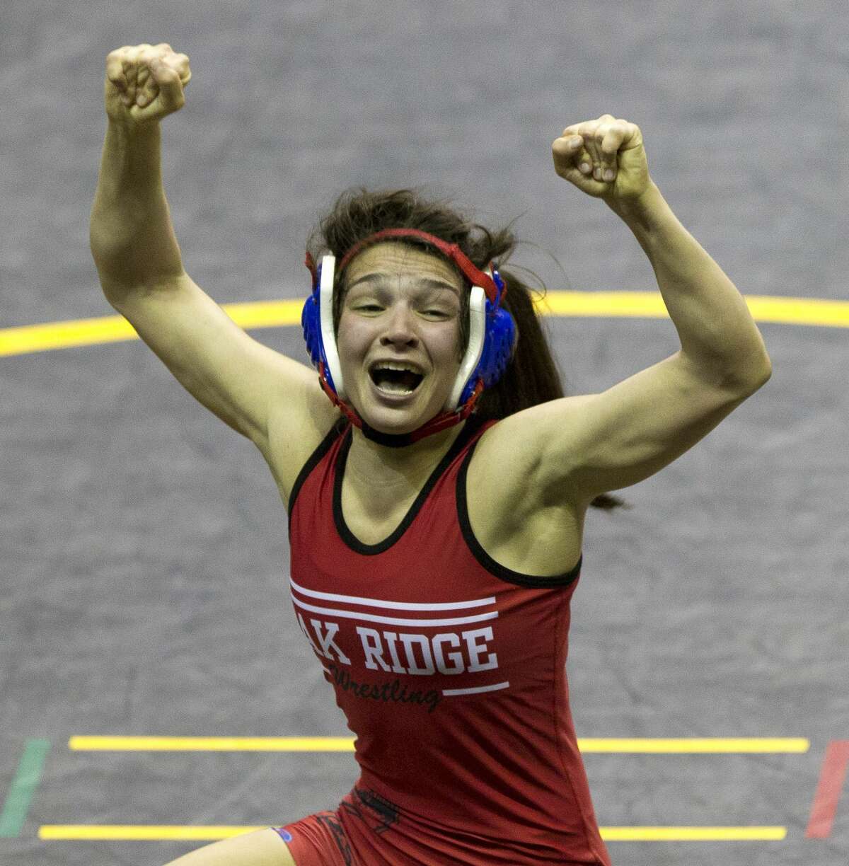 Annamarie Crixell of Oak Ridge reacts after winning third place in the Class 6A girls 110-pound weight class during the UIL State Wrestling Championships at the Berry Center, Saturday, Feb. 24, 2018, in Cypress.