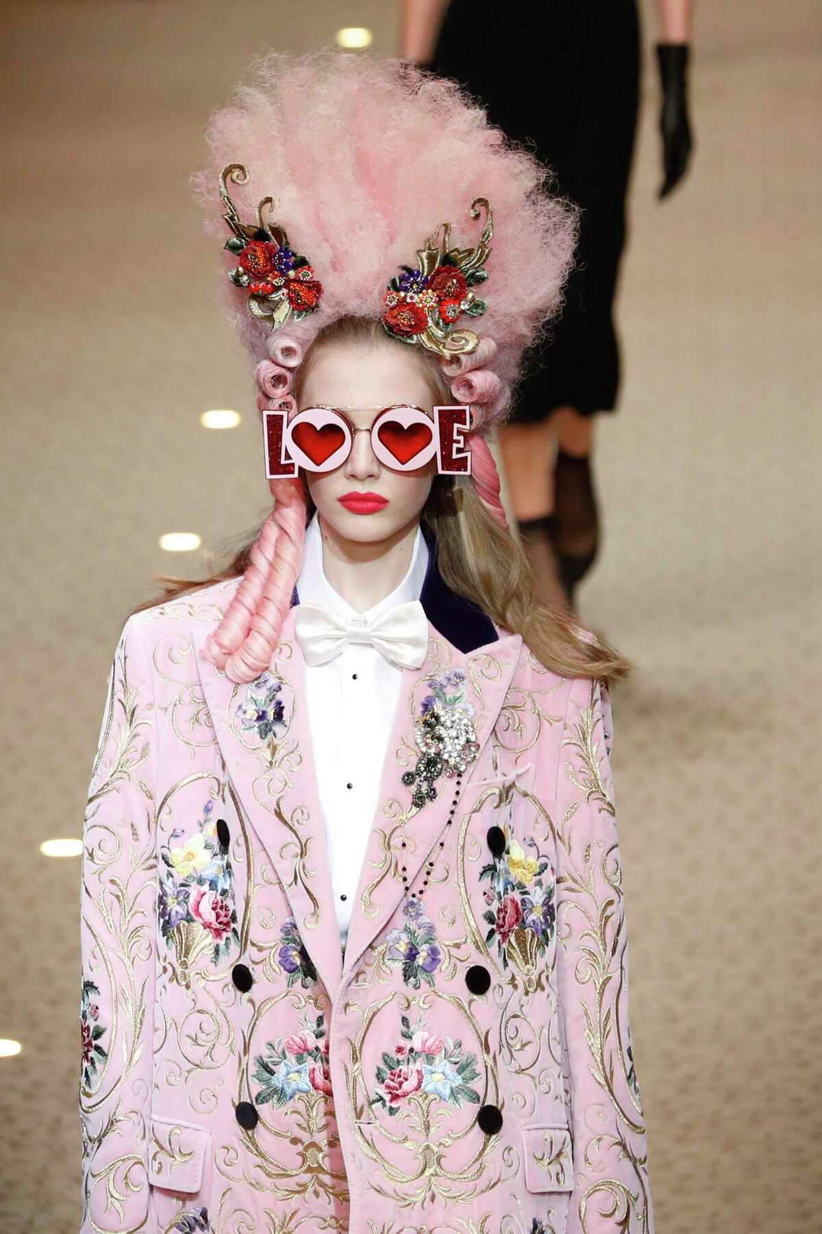 A model wears a creation as part of the Dolce & Gabbana women's Fall/Winter 2018-2019 collection, presented during the Milan Fashion Week, in Milan, Italy, Sunday, Feb. 25, 2018.