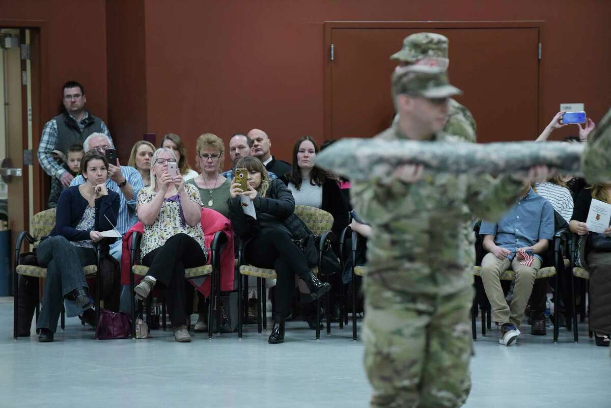 Family and friends watch during a mobilization ceremony for members of the New York National Guard 501st Ordnance Battalion at the Scotia Glenville Armed Forces Reserve Center on Sunday, Feb. 25, 2018, in Glenville, N.Y. The members of the battalion are deploying to Afghanistan. (Paul Buckowski/Times Union)