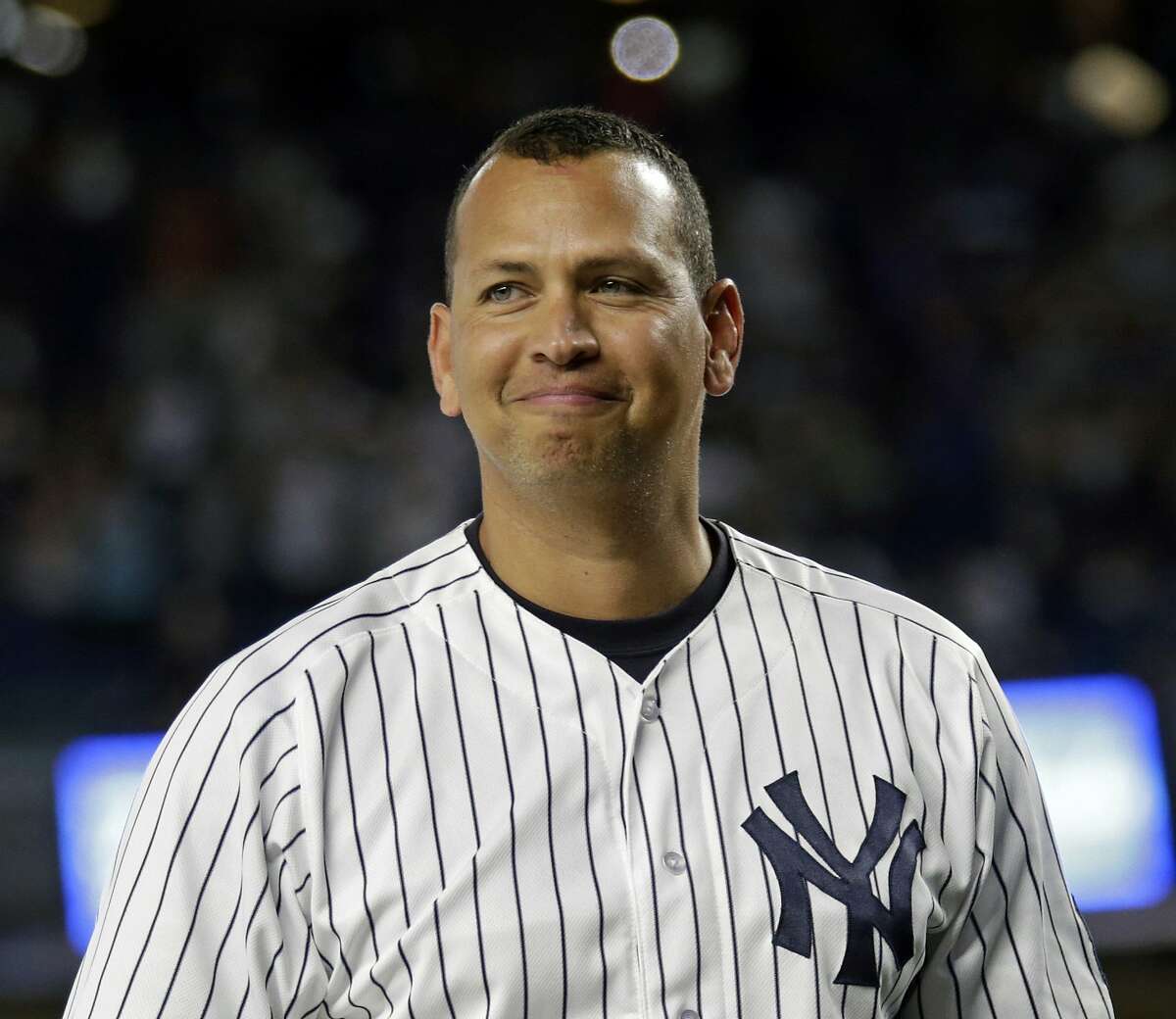 FILE - In this Aug. 12, 2016, file photo, New York Yankees' Alex Rodriguez smiles during a ceremony prior to his final baseball game with the team, against the Tampa Bay Rays in New York. New York said Sunday, Feb. 25, 2018, that Rodriguez is remaining with the New York Yankees as a special adviser. (AP Photo/Adam Hunger, File)