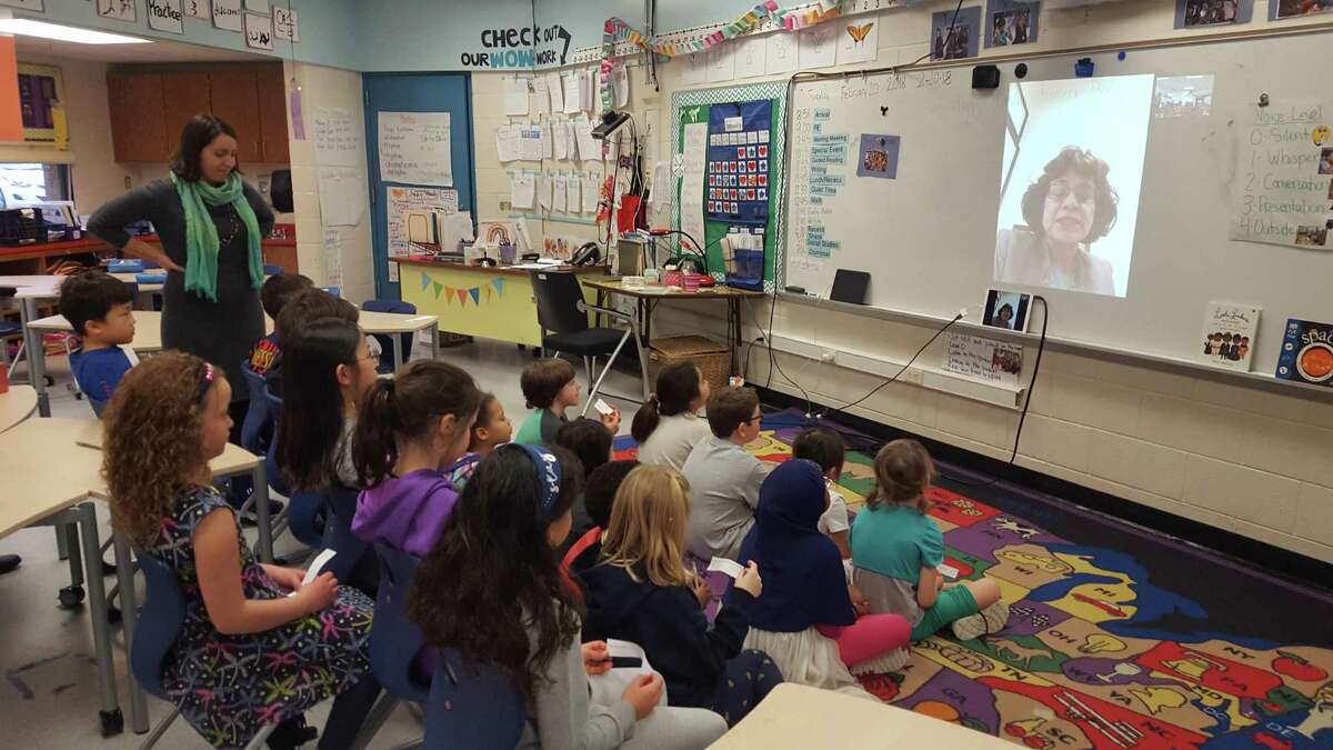 Emma Gallo-Chasanoff, a teacher in Ann Arbor, Michigan, leads her second-graders in a question-and-answer sessions with San Antonio lawyer Sharyll Teneyuca, author of "It's Not Fair! Emma Tenayuca's Struggle for Justice."