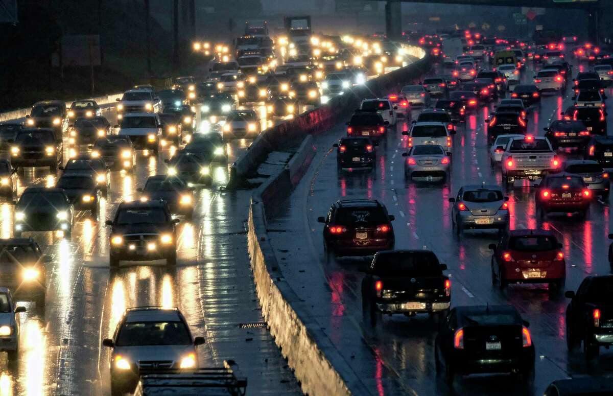 FILE - In this Jan. 12, 2017 file photo, early morning rush hour traffic crawls along the Hollywood Freeway toward downtown Los Angeles. One promise of ride-hailing companies was a drop in the number of cars in urban areas and an easing of clogged city streets. But a survey by an urban planning group suggests the opposite: That ride-hailing companies may be pulling riders off buses, subways and bicycles and putting them in cars. (AP Photo/Richard Vogel, File)