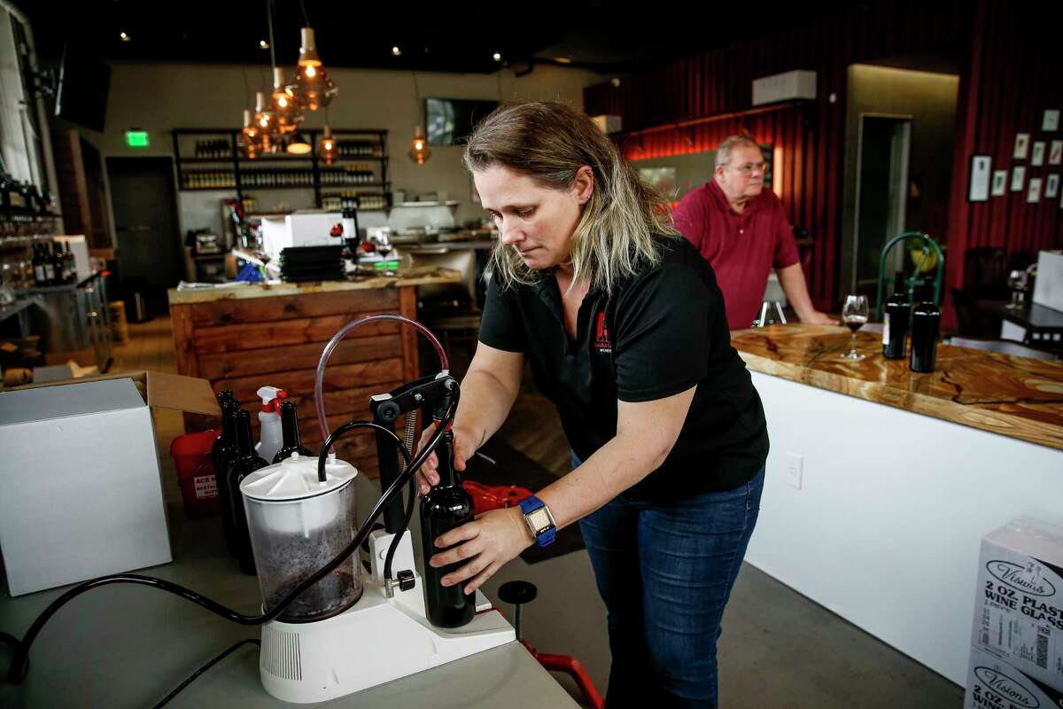 Sable Gate Winery owner and winemaker Szilvia Konya bottles her Monterey County Syrah at the Midtown winery Thursday, Feb. 22, 2018 in Houston. The winery offers tastings and the possibility to bottle and label your own wine. (Michael Ciaglo / Houston Chronicle)