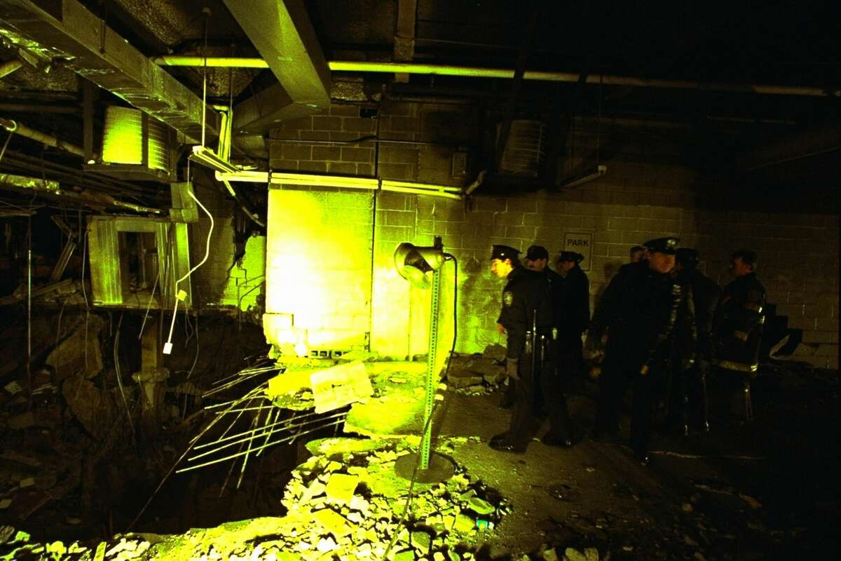 New York City police and firefighters inspect the bomb crater inside the World Trade Center on February 27, 1993, one day after the fatal attack by an Islamic faction. Six people were killed and more than 1,000 injured in the bombing. (AP Photo/Richard Drew)