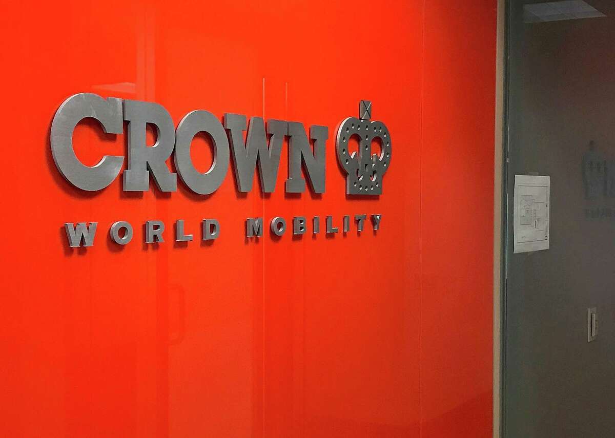 A sign greets visitors at the entrance to Crown World Mobility in Danbury, Conn., on Monday, Feb. 26, 2018.