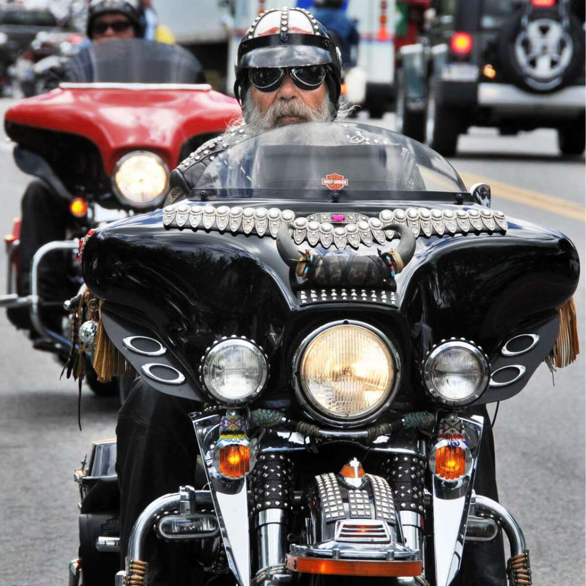 Motorcyclist Mike Blout of Bristol, NY, rides his much-modified 1999 Harley Police Special up Canada Street in Lake George Village during the annual Americade Tuesday June 8, 2010. 