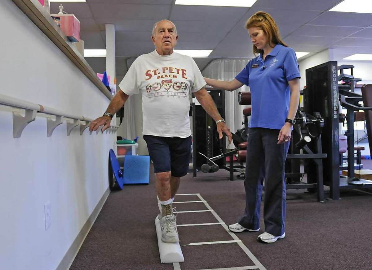 Physical Therapist Karen Haber, right, works with Rich Chipman, of Schodack, at Columbia Physical Therapy in East Greenbush. The Rich Chipman and Joe Chipman are father and son. (Lori Van Buren/Times Union)