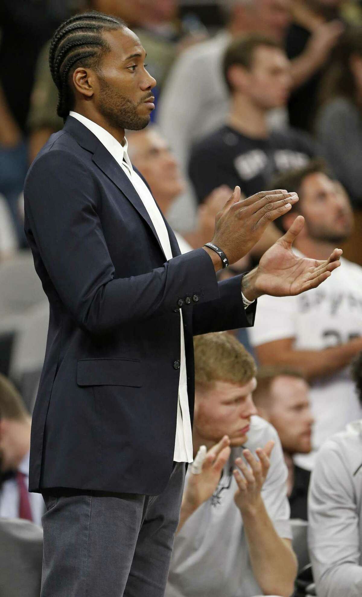 San Antonio Spurs?• Kawhi Leonard applauds for the team late in second half action against the Toronto Raptors Monday Oct. 23, 2017 at the AT&T Center. The Spurs won 101-97.