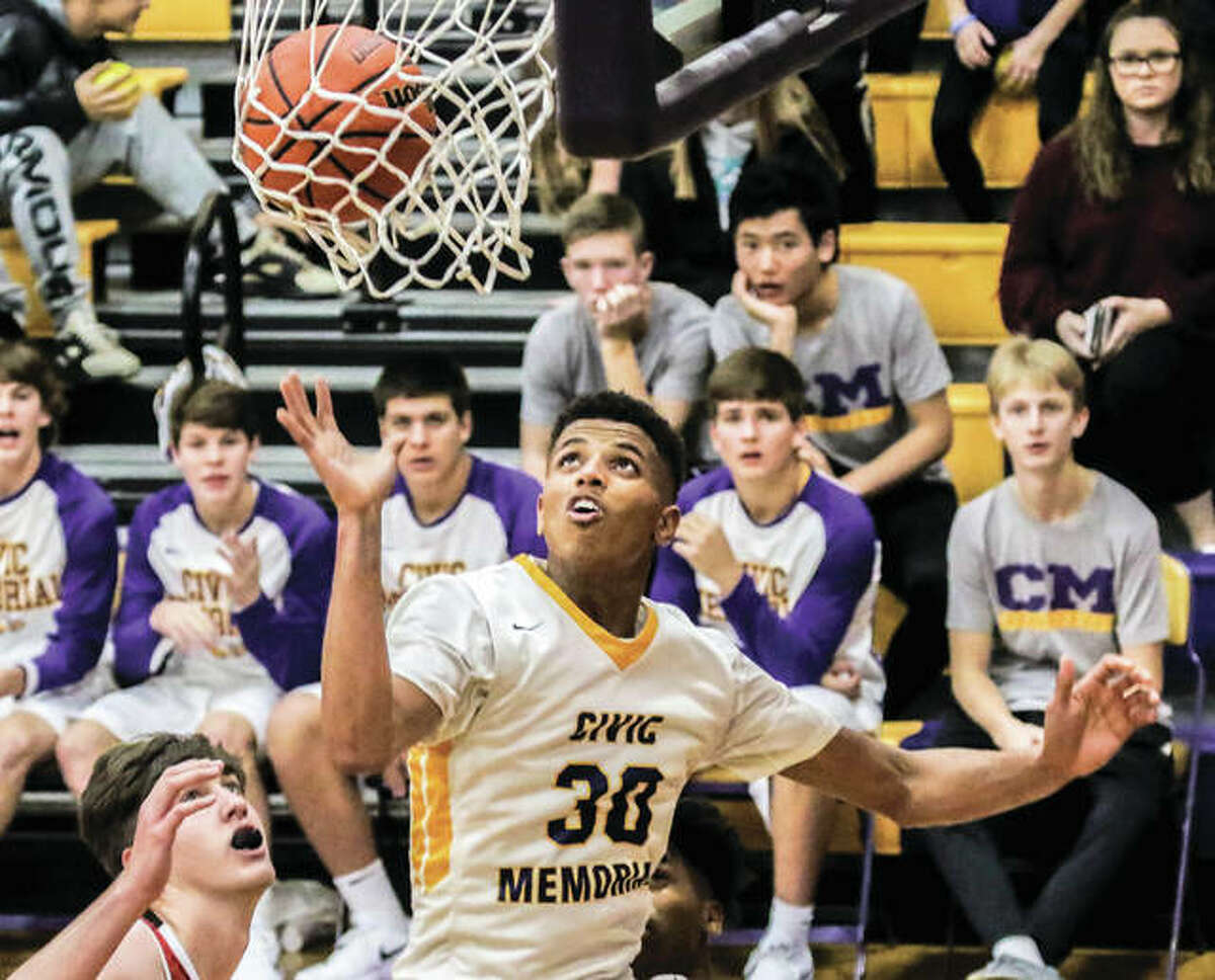 Civic Memorial’s Jaquan Adams (30), shown scoring during a game against Granite City on Nov. 22 in Bethalto, scored a career-high 33 points Tuesday night to lead the Eagles to a MVC victory over Mascoutah in Bethalto.