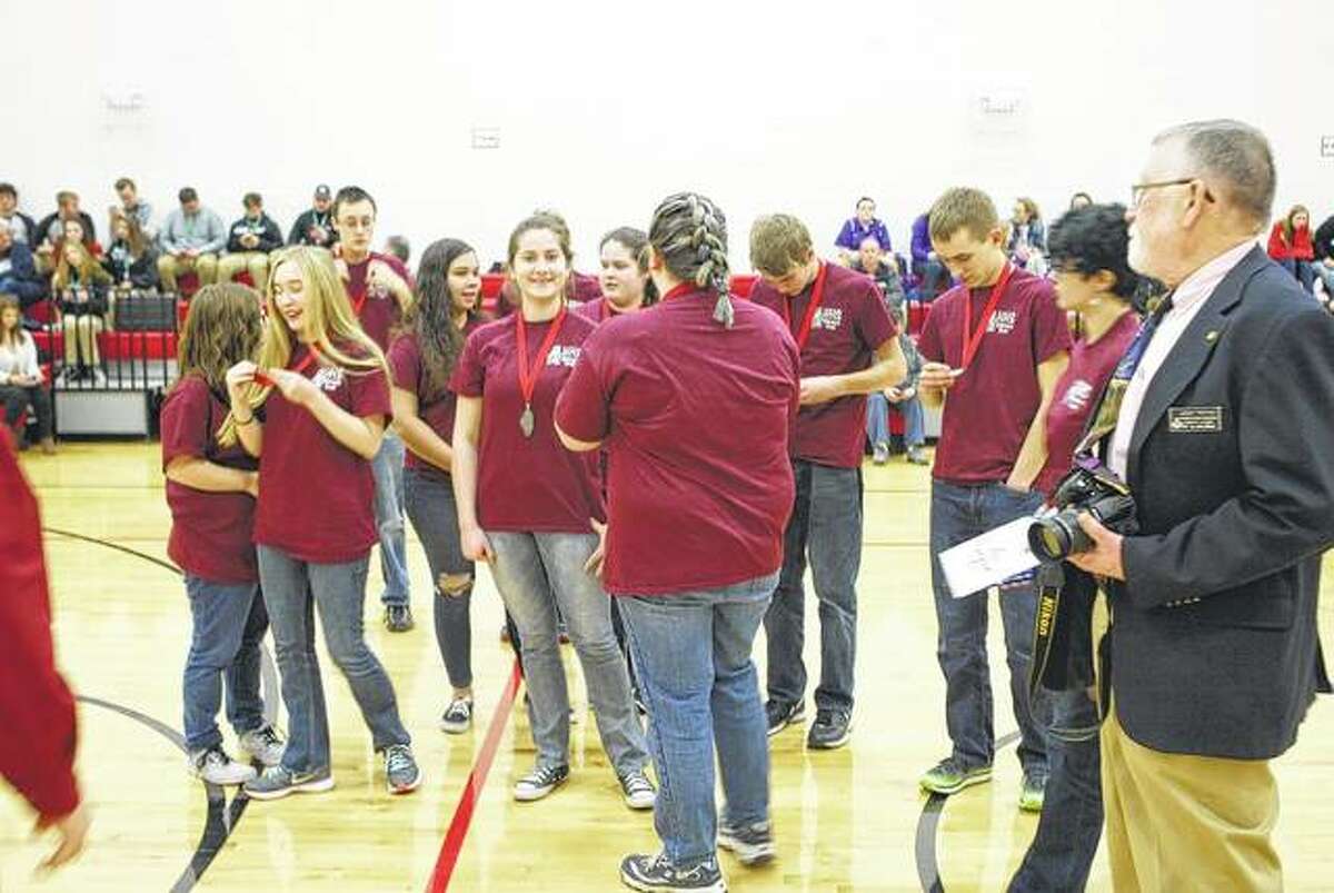 The Havana High School academic bowl team receives second-place medals Saturday at Virginia High School.