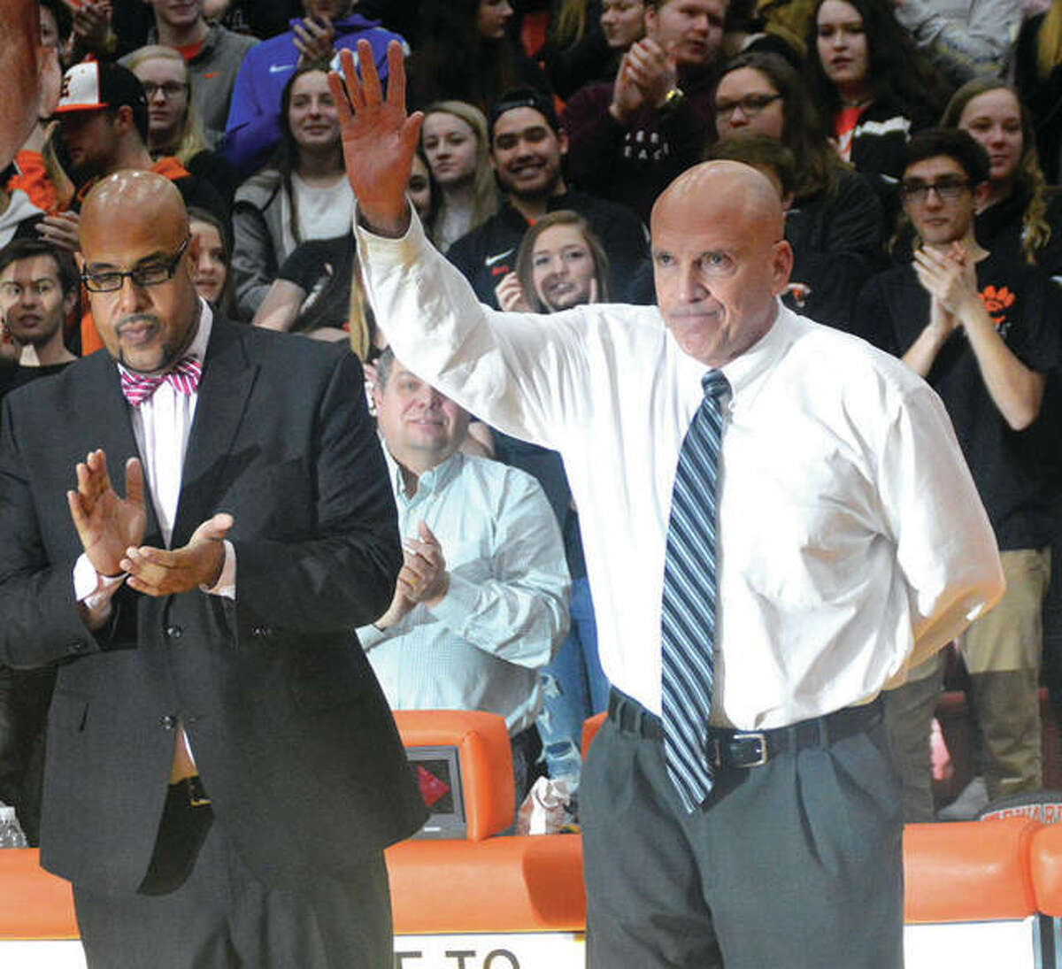 Edwardsville coach Mike Waldo, right, acknowledges the crowd during a pregame ceremony before Friday’s game against Belleville East. It was Waldo’s final home game as coach. EHS athletic director Alex Fox at left.