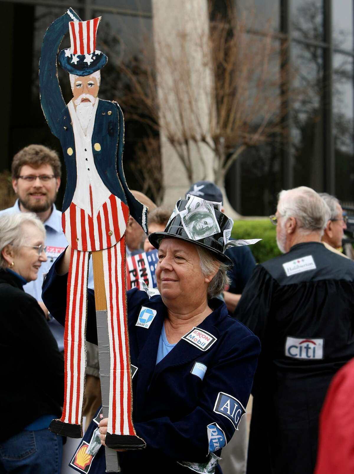 Vibeke Lee holds an Uncle Sam puppet during a protest by the group Move to Amend staged on Friday Jan 20, 2012 to rally for overturning the Supreme Court's majority decision of Citizens United v. Federal Election Commission responsible for the flood of anonymous dollars now usurping our political process with untraceable corporate dollars and to get more organized. 