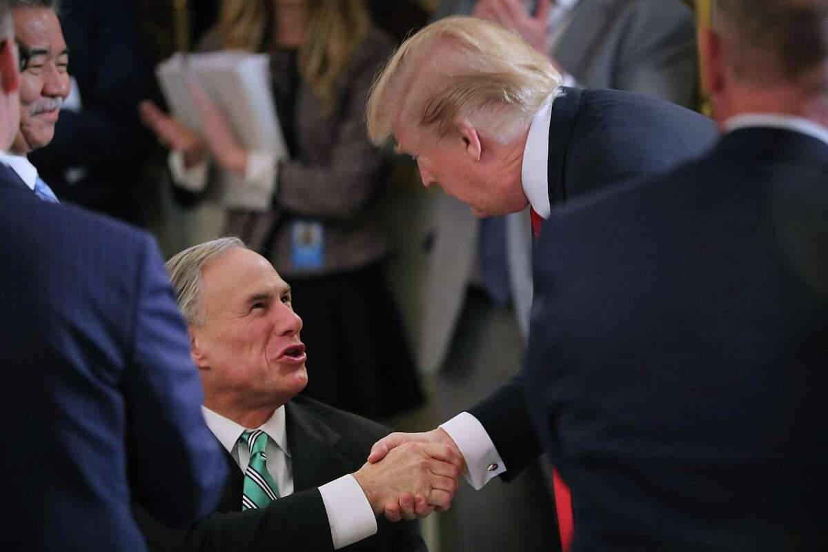WASHINGTON, DC - FEBRUARY 26: U.S. President Donald Trump greets Texas Governor Gregg Abbott during a business session with state governors in the State Dining Room at the White House February 26, 2018 in Washington, DC. The National Governors Association is holding its annual winter meeting this week in Washington. (Photo by Chip Somodevilla/Getty Images)