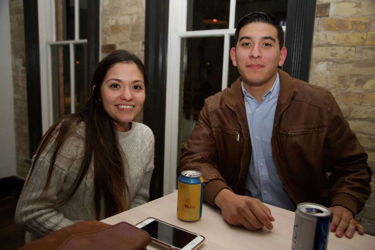 Kayla Garcia and Robby Garcia are having a beer at Con Safos.