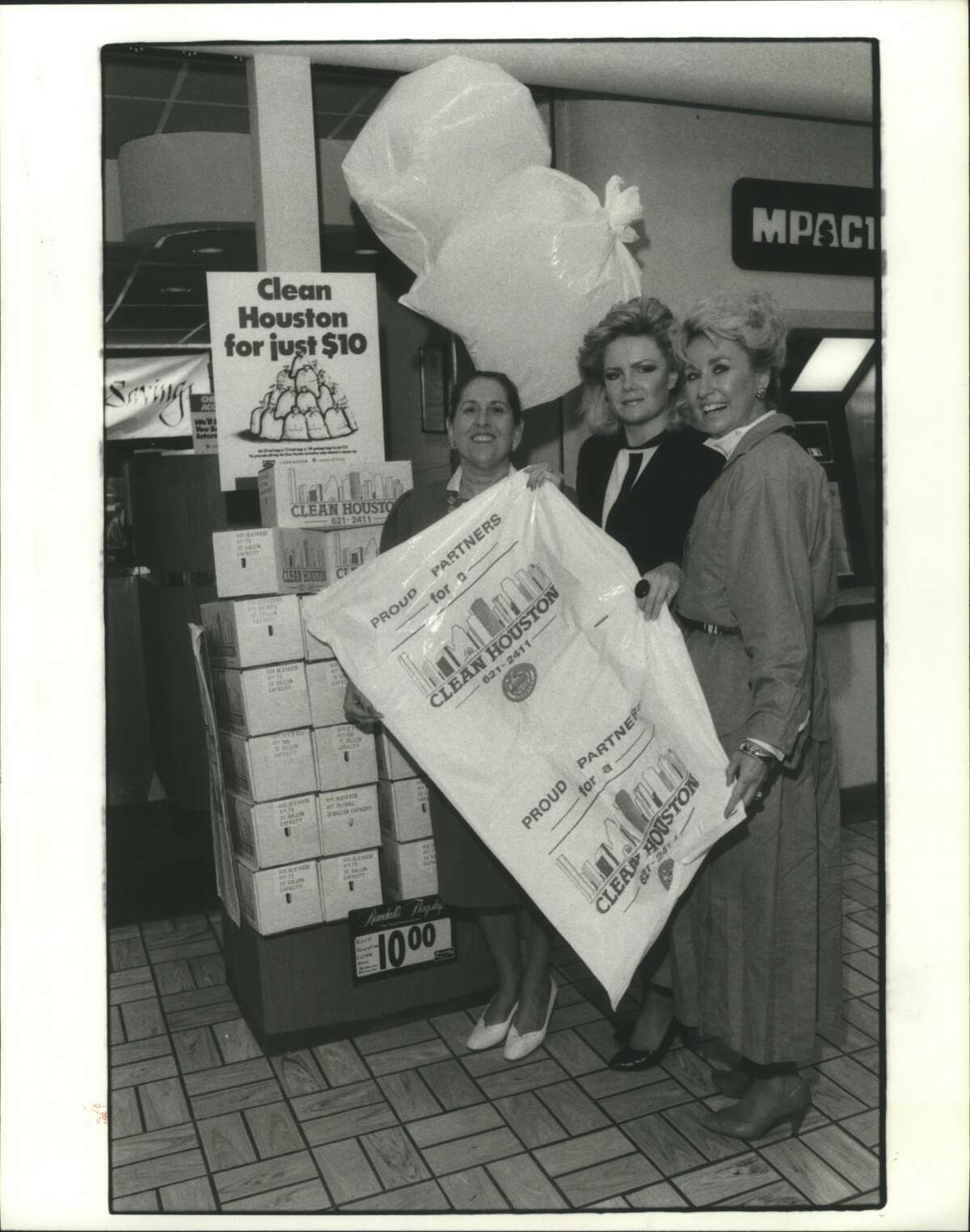 April 28, 1987Clean Houston members Laura Lee Blanton, left, Melissa K. Fall and Charlotte Schlimper show off the trash bags that Houstonians may buy at area Randall's grocery stores to raise money for their organization. Blanton is commissioner of the trash bags fundraiser.
