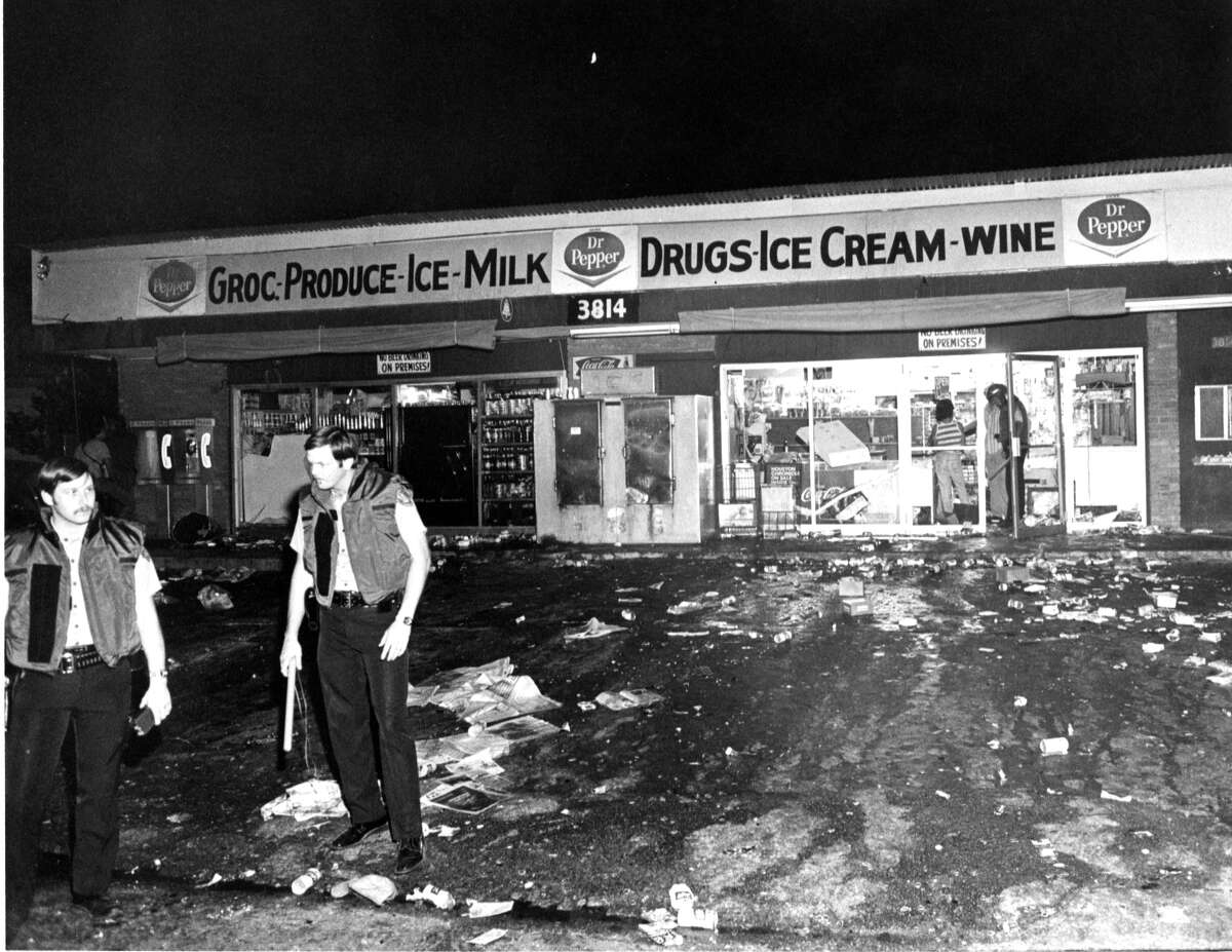 May 7, 1978Officers guard drive-in grocery at 3814 Fulton that was looted by Moody Park rioters.
