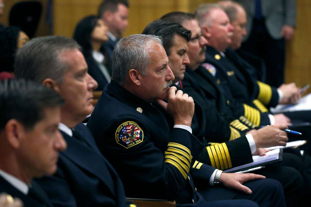 Santa Rosa Fire Chief Tony Gossner sits with other chiefs from around the state before he addresses a joint informational hearing on emergency management and California's fire mutual aid system at the state Capitol in Sacramento, Calif. on Tuesday, Feb. 27, 2018.