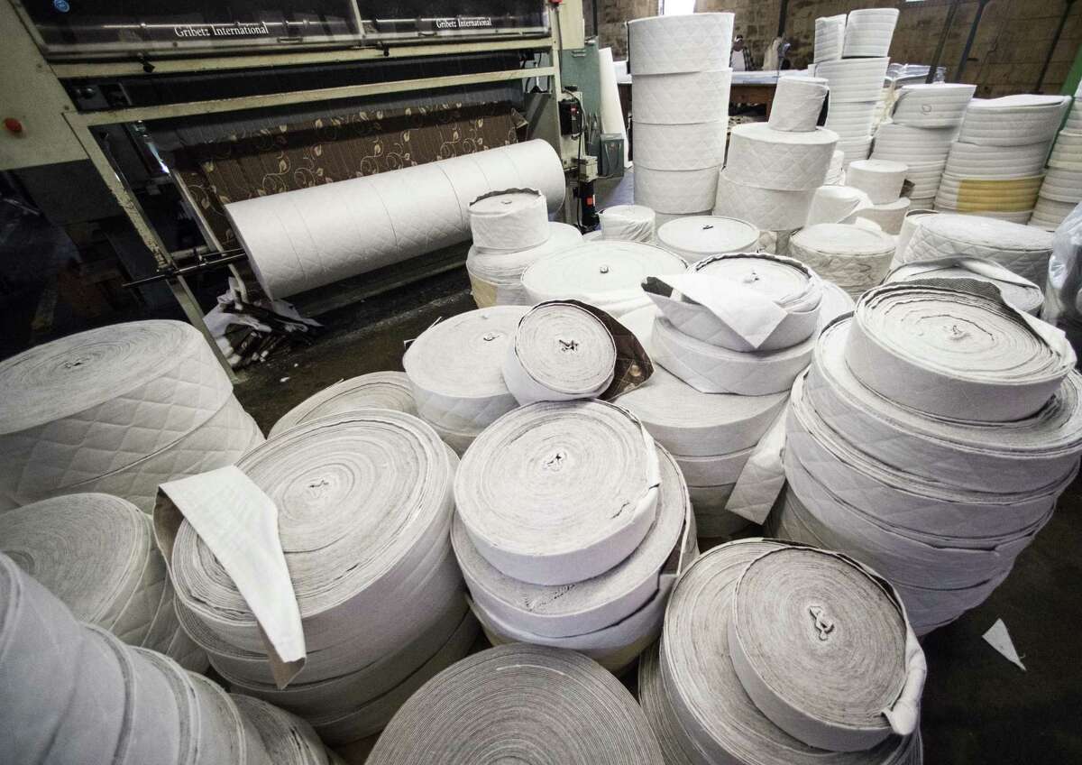 Rolls of fabric to cover mattresses stacked at the factory of Texas Mattress Makers, Tuesday, Feb. 6, 2018, in Houston. ( Marie D. De Jesus / Houston Chronicle )