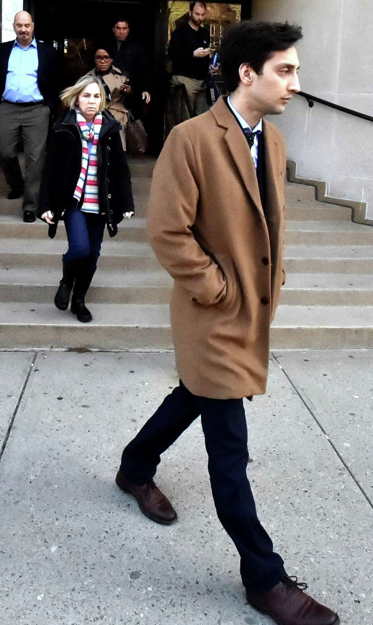 Saifullah Kahn, a former Yale student on trial for allegedly sexually assaulting a female classmate, leaves Superior Court in New Haven Tuesday .