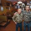 Bobby and Rick Consiglio, former owners and now serving as consultants at Sally’s Apizza, Tuesday in the iconic dining room on Wooster Street in New Haven.