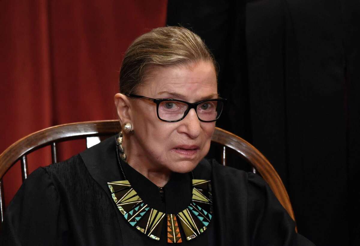 Investors should’ve first been tipped off that LeadInvest, a company reportedly peddling cryptocurrency-related investments, was misleading when they browsed the company’s website and found a photo of a group that included Supreme Court Justice Ruth Bader Ginsburg (pictured).