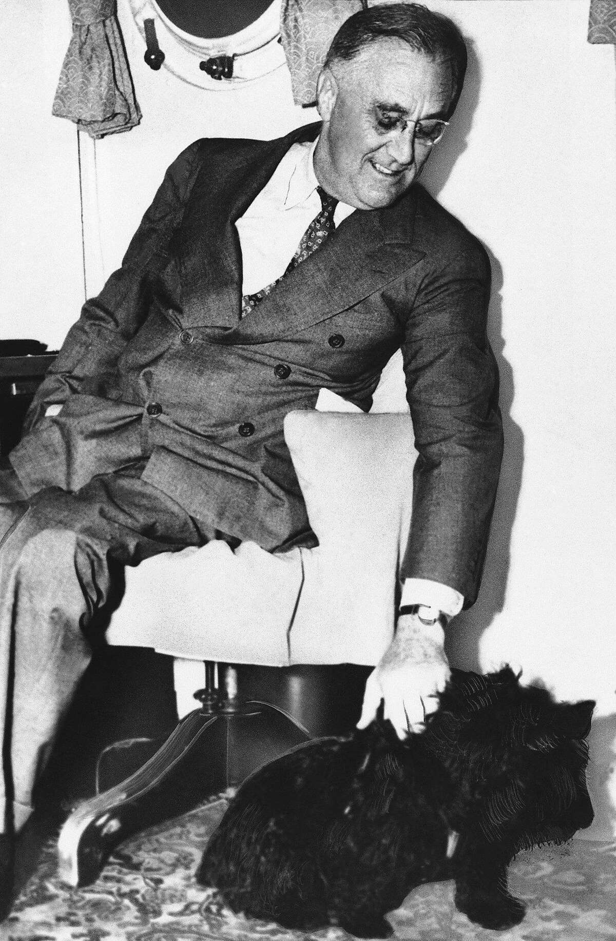 Shown in an undated photo of United States President Franklin D. Roosevelt with his pet dog ?Fala?. (AP Photo)