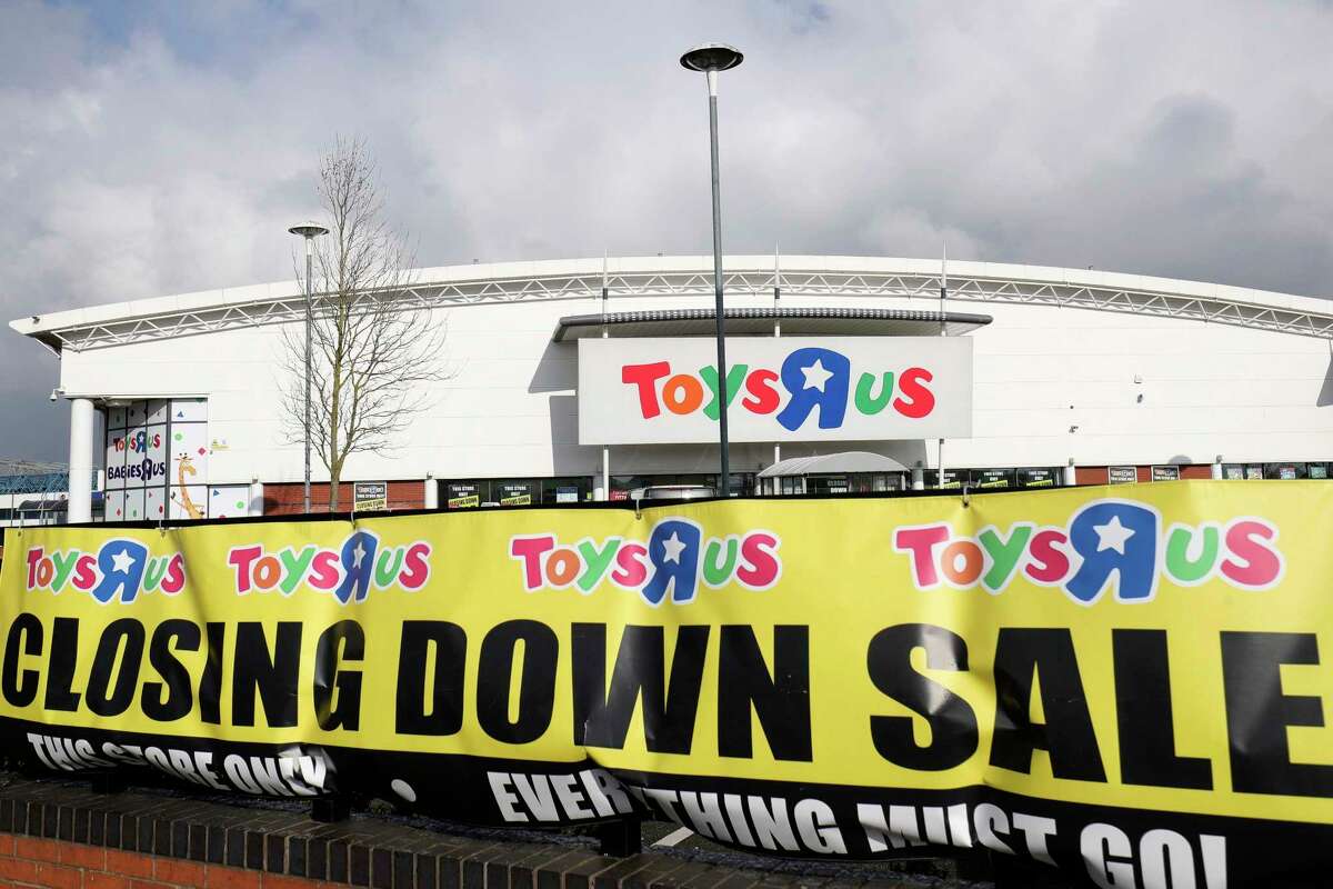 In this Feb. 27, 2018 file photo, a branch of Toys R Us at St Andrews retail park in Birmingham, England, displays a closing down sale banner. The British arm of Toys R Us has gone into insolvency administration, Wednesday Feb. 28, 2018, putting 3,200 jobs at risk. 
