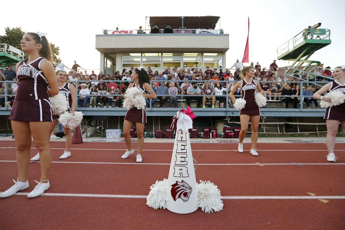 Trinity University cheerleaders stand near a white megaphone for Trinity University student and cheerleader Cayley Mandadi, 19, during the Trinity football came against Austin College held Saturday Nov 4, 2017 at Trinity University. Mandadi died Tuesday Oct. 31, 2017 at a hospital in Kyle.