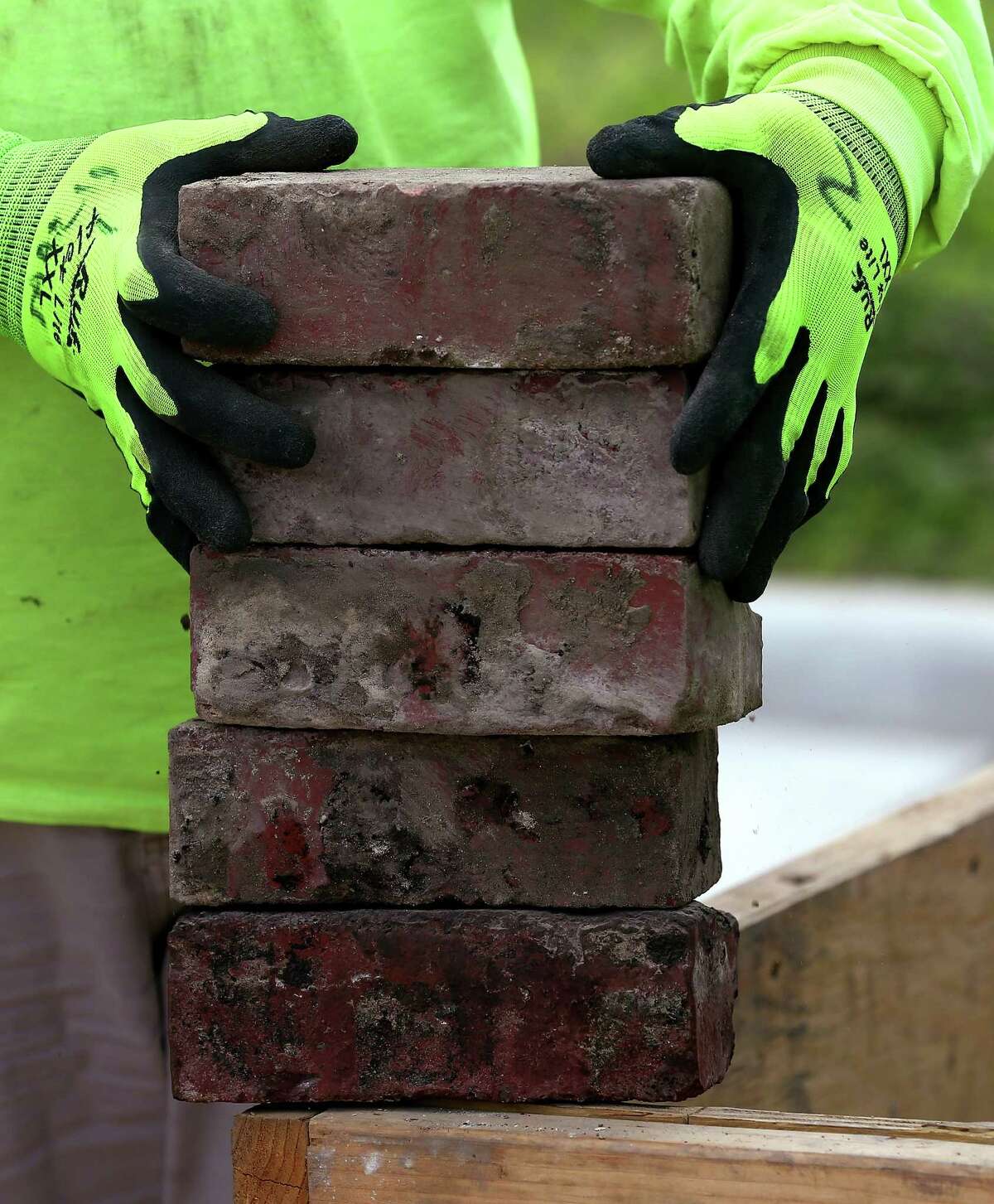 Houston Public Works crews re-install the historic bricks on the corner of Andrews and Genesee streets in Freedman's Town Wednesday, Feb. 28, 2018, in Houston. ( Godofredo A. Vasquez / Houston Chronicle )