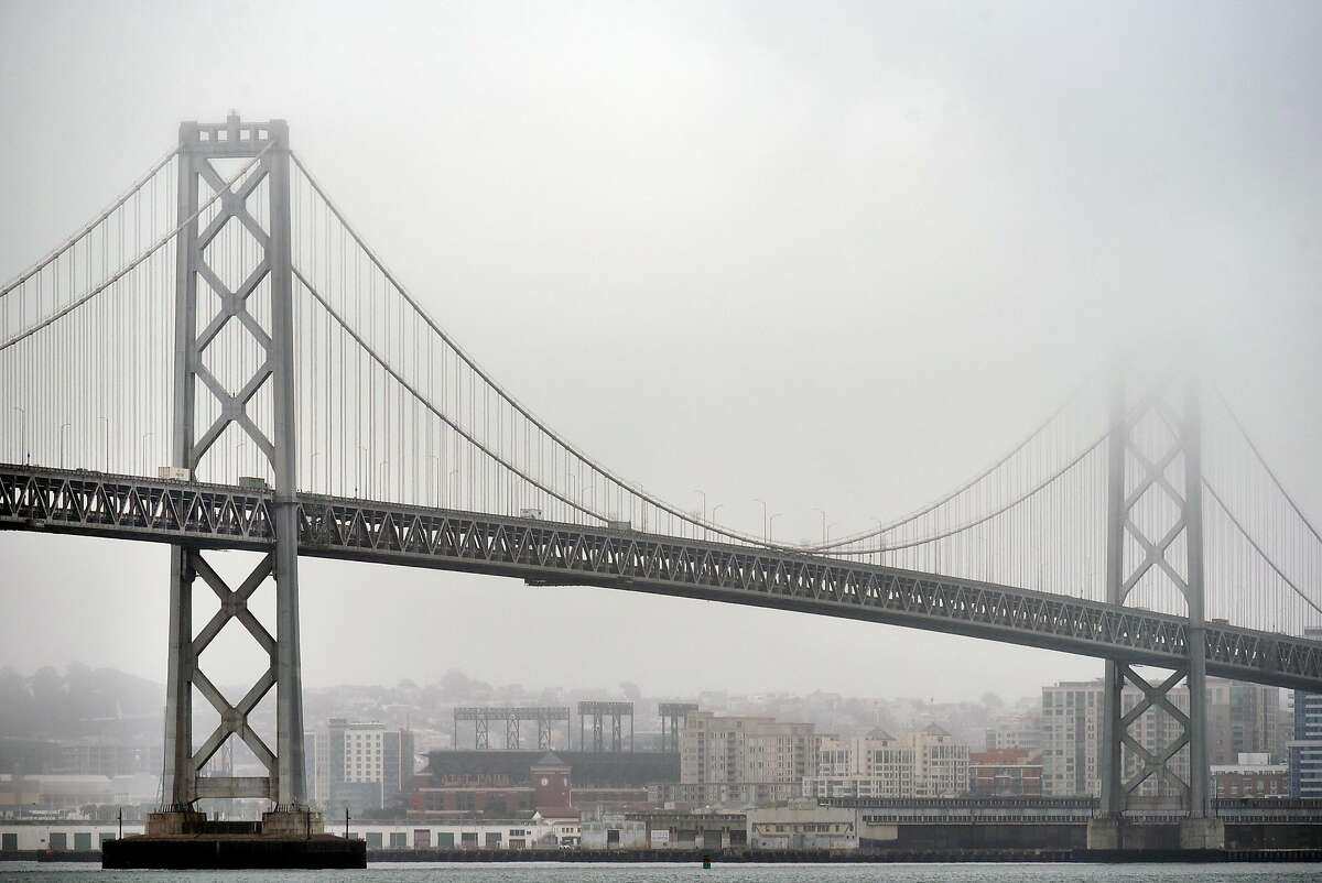 Fog and clouds hang over the Bay Bridge in San Francisco, CA, on Thursday August 24, 2017.