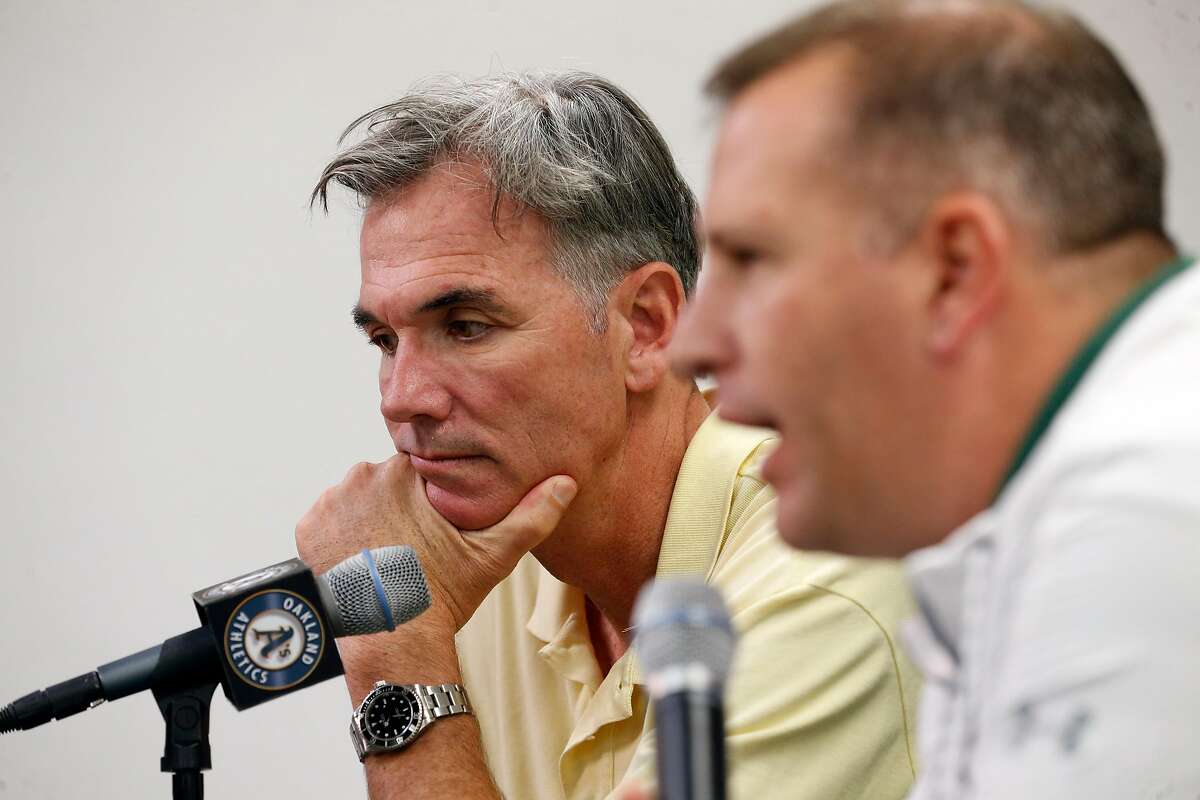 Oakland Athletics' VP of baseball operations Billy Beane, (left) and general manager David Forst talk about the baseball season during a press conference at the Oakland Coliseum on Mon. Oct. 2, 2017, in Oakland, Ca.