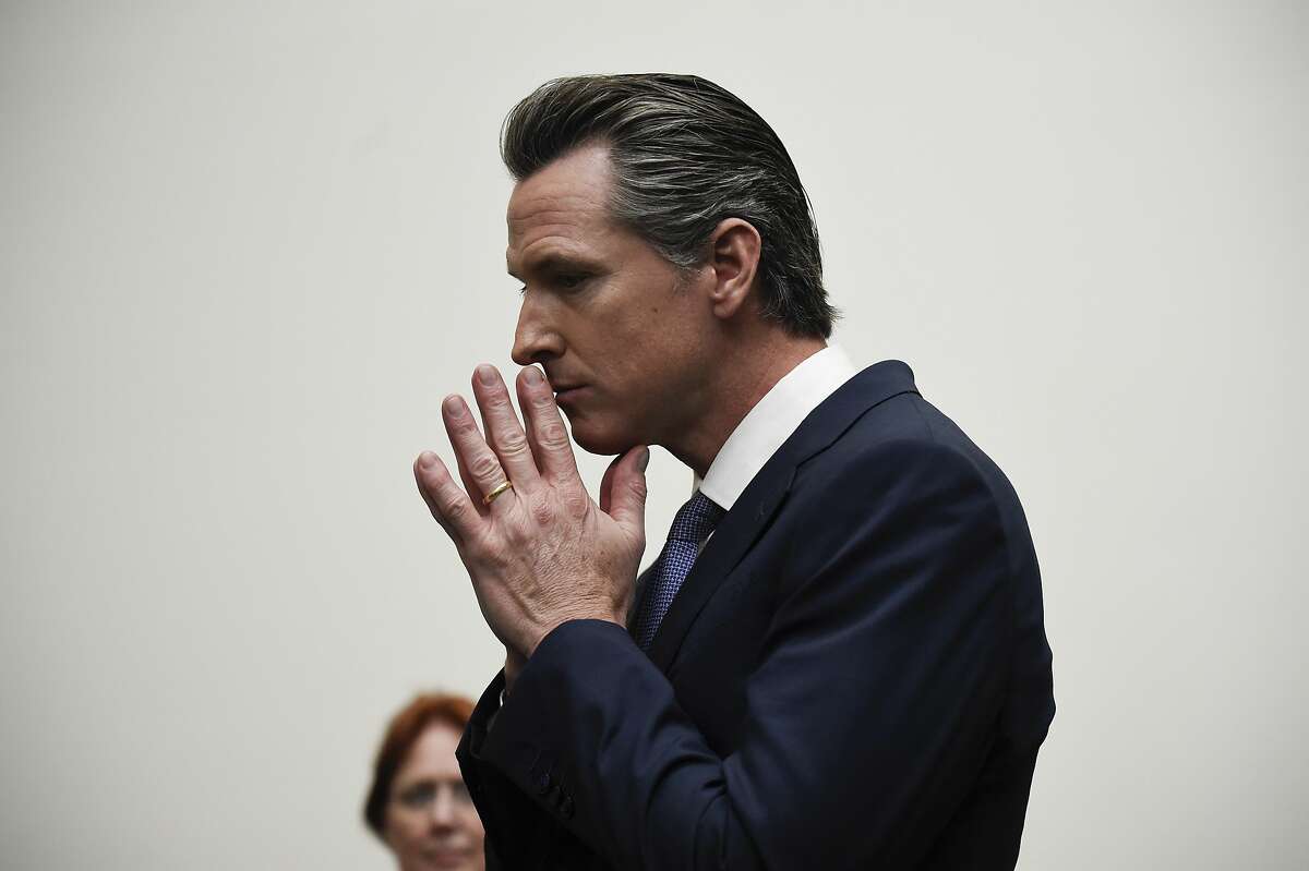 Democratic gubernatorial candidate Gavin Newsom listens to a question while speaking with delegates at the 2018 California Democrats State Convention Saturday, Feb. 24, 2018, in San Diego. (AP Photo/Denis Poroy)