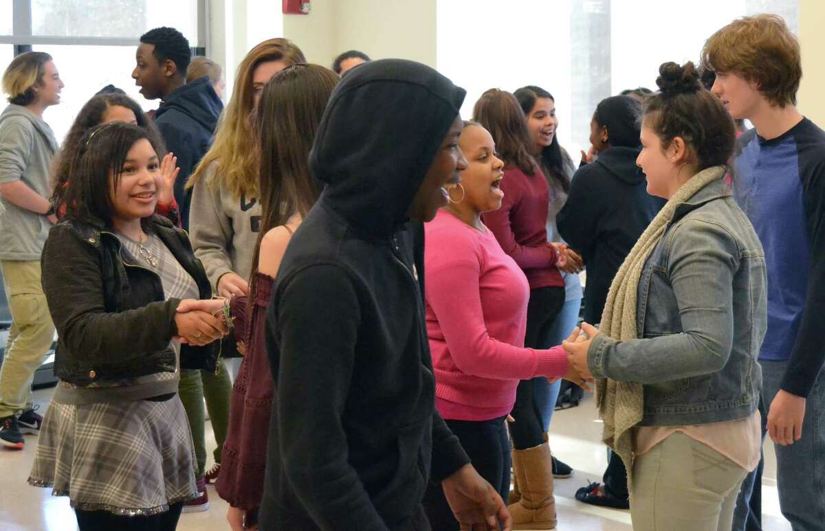 Students greet each other at the Trumbull workshop.