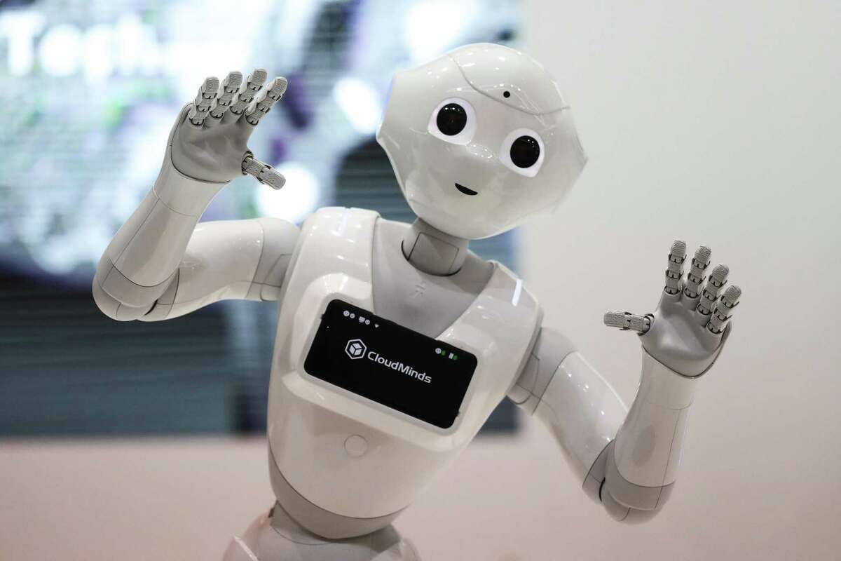 A SoftBank Group Corp. Pepper humanoid robot stands on display during day two of the Mobile World Congress (MWC) in Barcelona, Spain, on Tuesday, Feb. 27, 2018. At the wireless industry's biggest conference, more than 100,000 people are set to see the latest smartphones, artificial intelligence devices and autonomous drones exhibited by roughly 2,300 companies. Photographer: Simon Dawson/Bloomberg