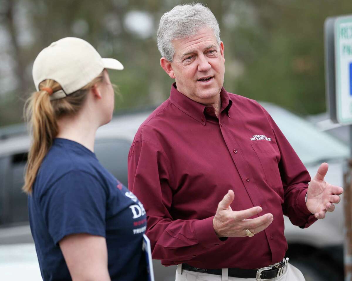 Craig Doyal, Montgomery County Judge incumbent, speaks with voters outside of the South County Community Center polling location during the first day of early voting on Tuesday, Feb. 20, 2018.