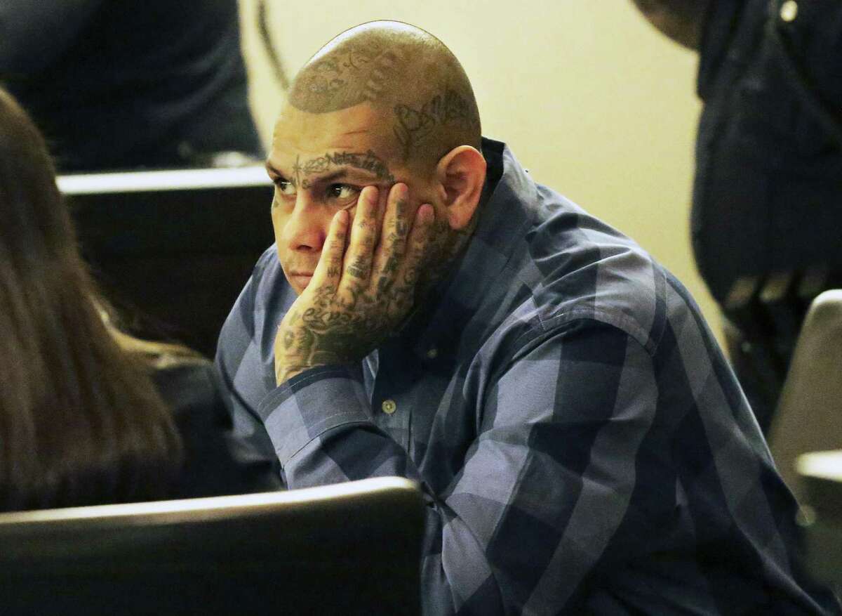 The defendent listens as he consults with his attorneys as testimony is heard on February 28, 2018 in the trial of Gabriel Moreno, accused of killing Jose Luis Menchaca.