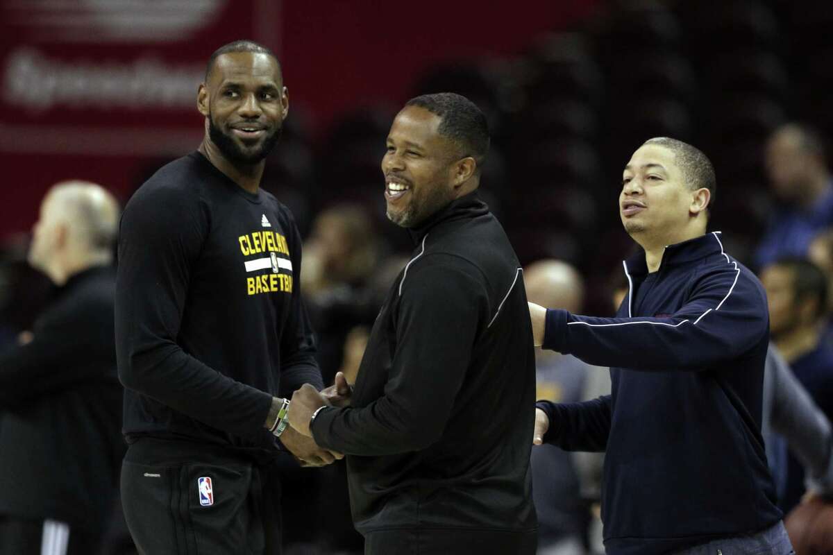 LeBron James (23) talks with Cavaliers Head Coach Tyronn Lue and former teammate Damon Jones, center, during an off-day practice before the Golden State Warriors played the Cleveland Cavaliers in Game 3 of the NBA Finals at Quicken Loans Arena in Cleveland, Ohio, on Tuesday, June 6, 2017.