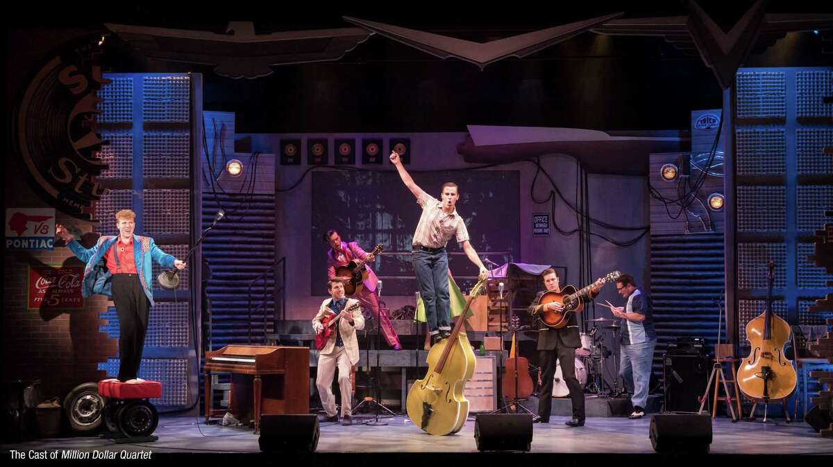 A high-energy moment on stage during one of the 20 songs in “Million Dollar Quartet.”