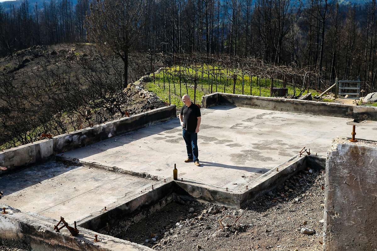 Per Rosdahl stands on the foundation where his home stood before the Tubbs fire destroyed his entire property in October 2017. Wednesday, Jan. 31, 2018 in Knights Valley, Calif.