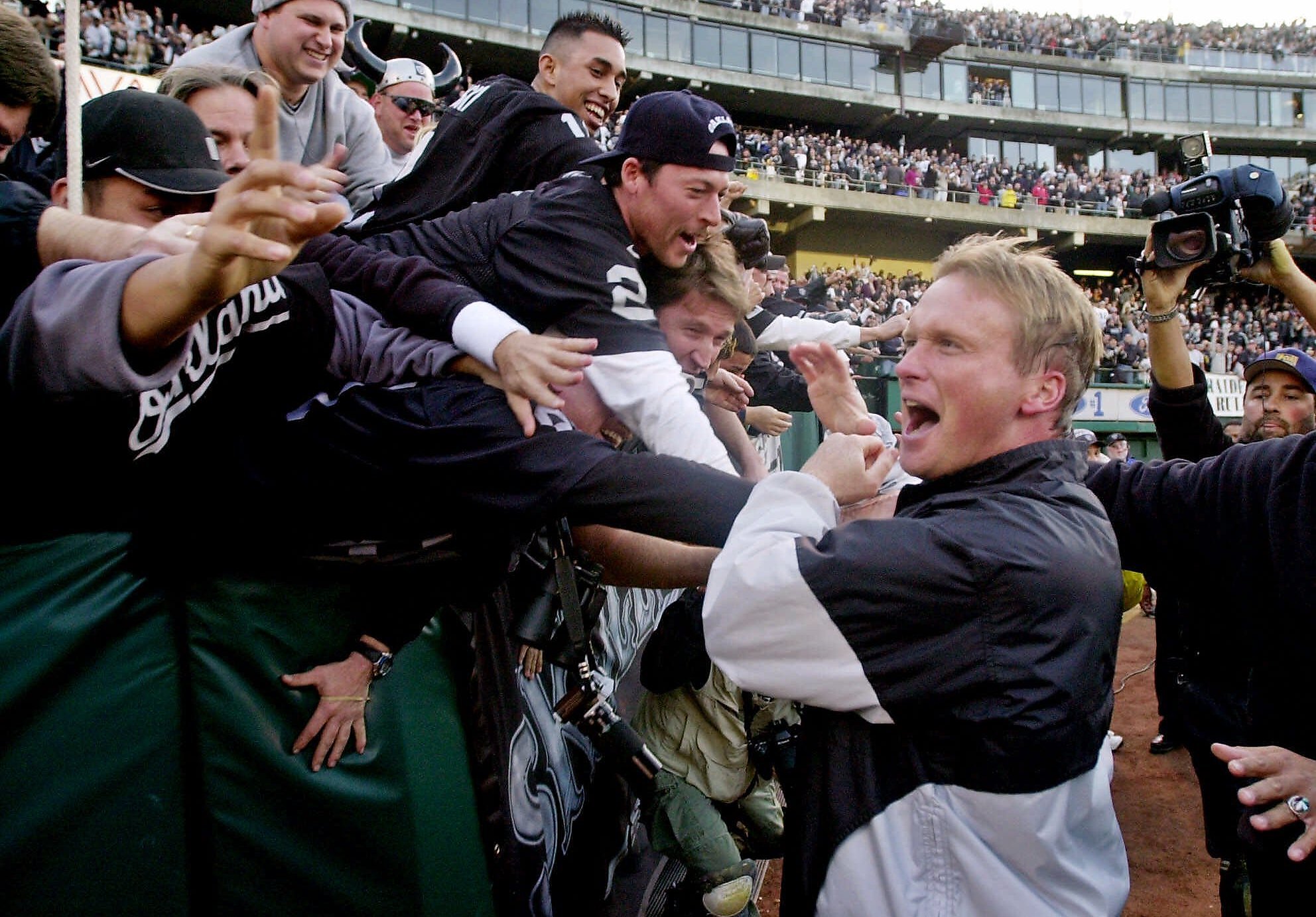 Head coach Jon Gruden of the Tampa Bay Buccaneers shakes hands