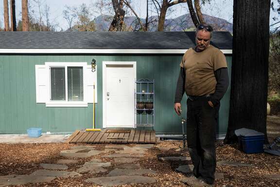 Bud Pochini's stands near his temporary modular home in his yard Wednesday, Jan. 31, 2018 in Knights Valley, Calif.