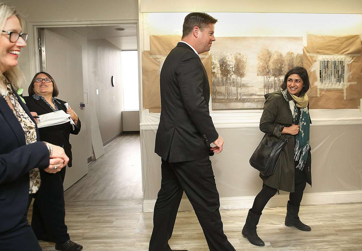 Executive VP of operations for Crestwood Behavioral Health, Patty Blum (far left), Ph.D., takes Mayor Mark Farrell (middle) and Aneeka Chowdry (right) on a tour of the Crestwood Healing Center consisting of 54 psychiatric beds for severely mentally disabled homeless patients at St. Mary's hospital on Friday, March 2, 2018, in San Francisco, Calif.
