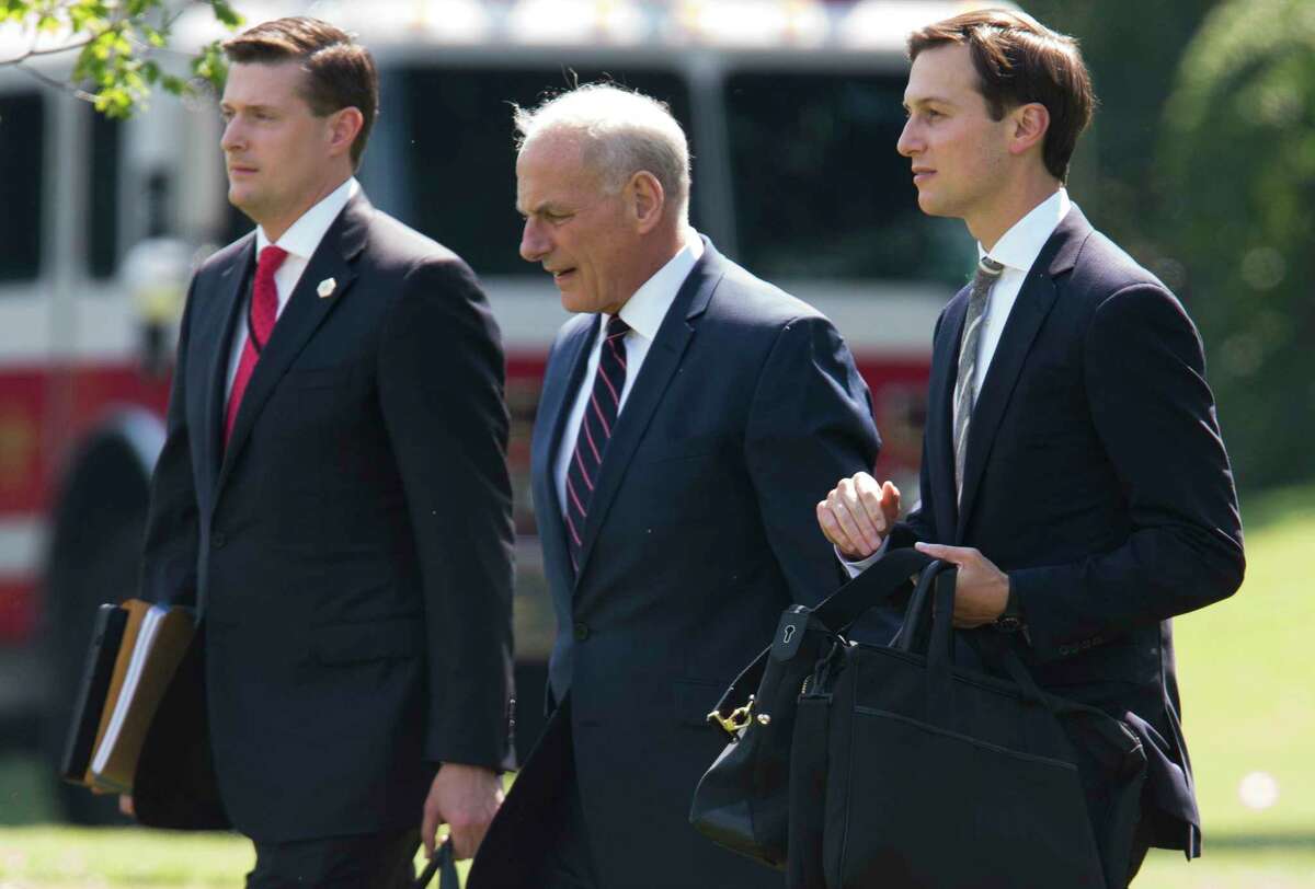 FILE-- From left: White House Staff Secretary Rob Porter, Chief of Staff John Kelly and Senior Adviser Jared Kushner at the White House in Washington, Aug. 4, 2017. After months of delays in completing an exhaustive background check, Kushner has been stripped of his high-level security clearance, limiting his ability to view highly classified information. (Tom Brenner/The New York Times)