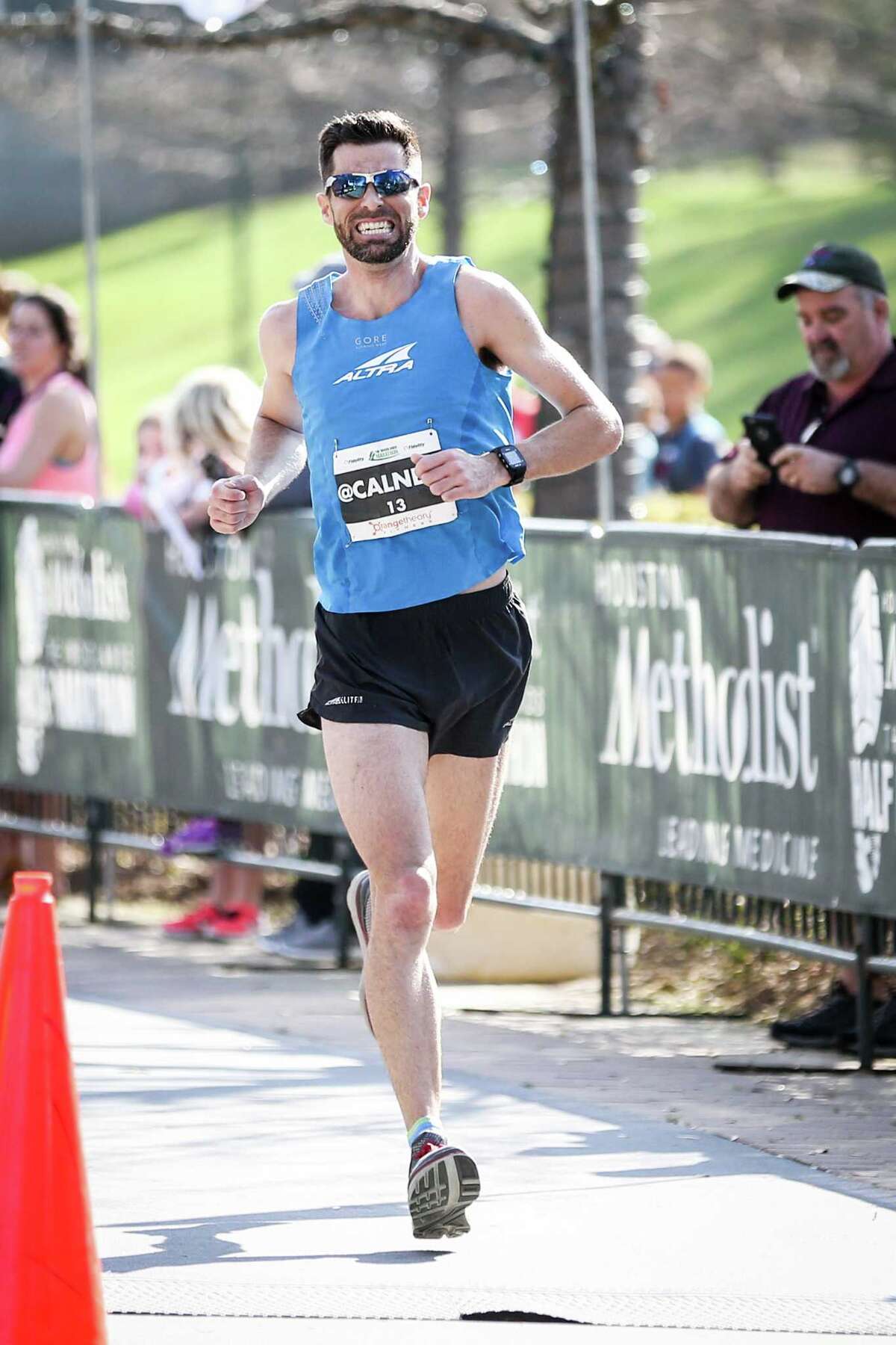 Thousands stride across the finish line of The Woodlands Marathon