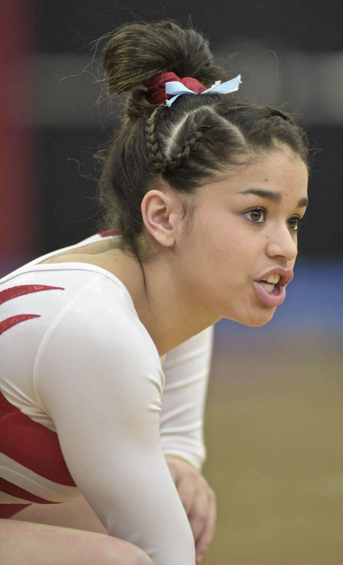 Adnerys De Jesus, Greenwich High School, cheers on a team mate at the Connecticut State Open gymnastics meet, Saturday, March 3, 2018, at Pomperaug High School, in Southbury, Conn.