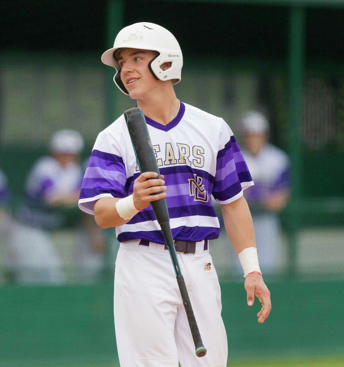 Jacob Prigmore (22) of Montgomery shares a laugh with the home plate umpier before an at bat in the second inning of a high school baseball game during the Montgomery-Brenham Tournament, Saturday, March 3, 2018, in Montgomery.