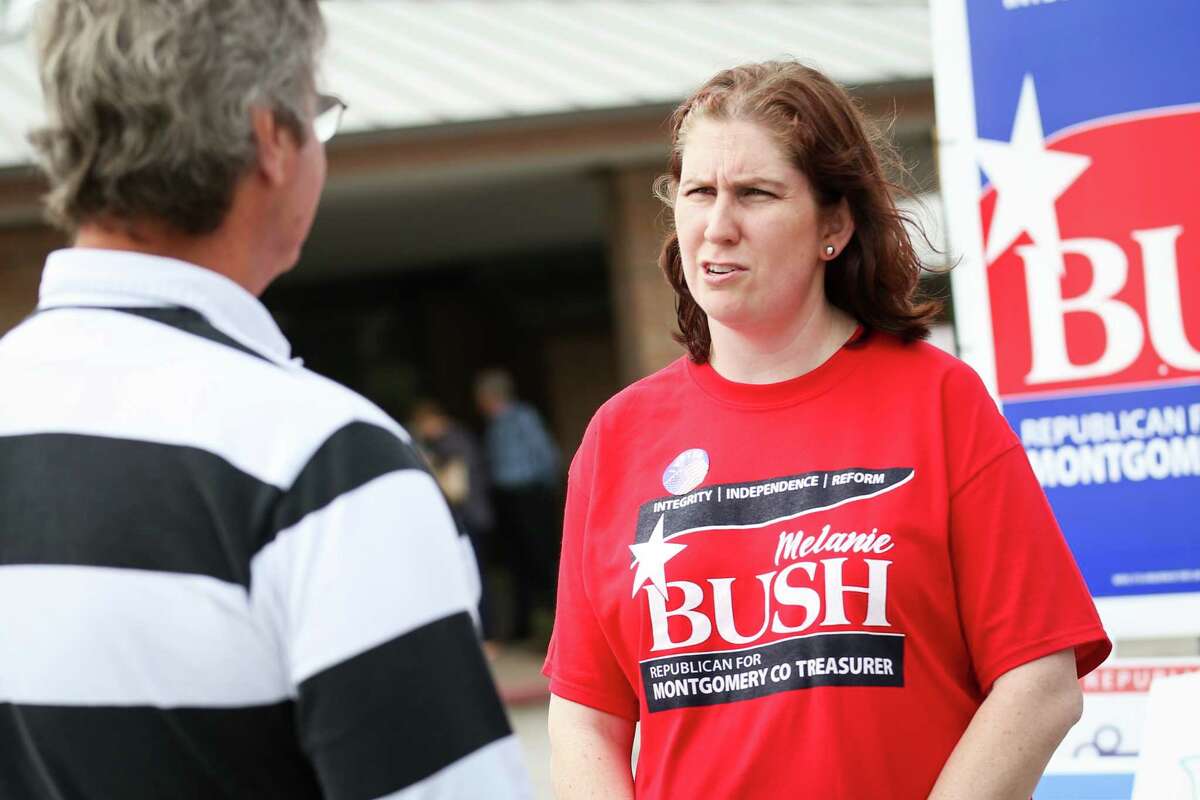 Montgomery County Treasurer candidate Melanie Bush speaks with voters outside of the South County Community Center polling location during the first day of early voting on Tuesday, Feb. 20, 2018.