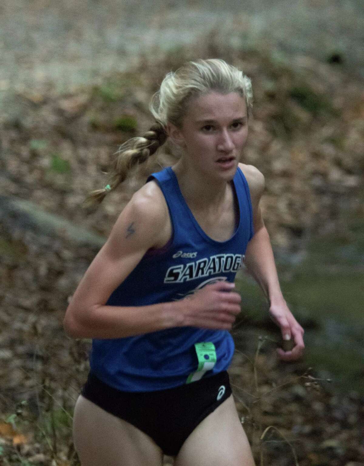 Saratoga's Kelsey Chmiel runs the 5k through Saratoga Spa Park during Suburban Council Championship girls varsity run in Saratoga Springs on Wednesday. Chmiel finished first with a time of 16:45:54. (Jenn March/Special to the Times Union)