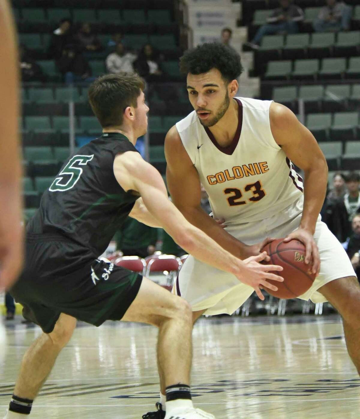 Colonie's Isaiah Moll looks for an opening past Shen's Christopher Hulbert during the Class AA Section II title game on Saturday, Mar. 3, 2018, at Cool Insuring Arena in Glens Falls, N.Y. Colonie fell to Shen 43-40 for the Class AA title. (Jenn March, Special to the Times Union)